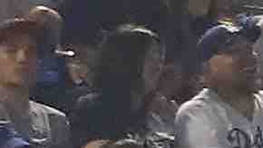 A banner with the words 'Trans People Deserve to Live' is displayed during Game Five of the 2018 World Series. Photo by Sean M. Haffey/Getty Images