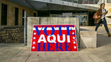 A pedestrian walks past Austin City Hall, an early voting center, on March 6, 2018 in Austin, Texas. Democrats are seeing a large increase in voter turnout compared to last year. Photo by Drew Anthony Smith/Getty Images