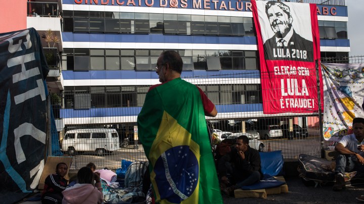 Supporters of former President Luiz Inacio Lula da Silva gather in front of the headquarters of the Metalworkers' Union while awaiting Lula's speech. Photo by Victor Moriyama/Getty Images