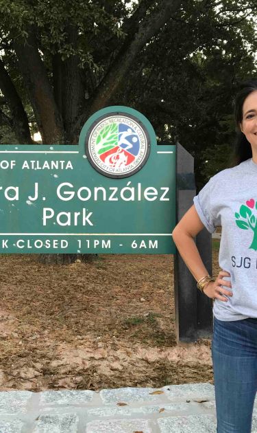Isabel González Whitaker poses in front of Sara J. Gonzalez Park, which was named after her mother. Photo courtesy of Isabel González Whitaker