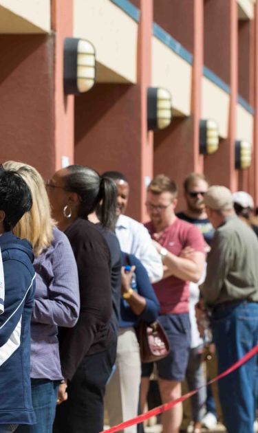 Voters wait in line for up to two hours to early vote at the Cobb County West Park Government Center on October 18, 2018 in Marietta, Georgia. Photo by Jessica McGowan/Getty Images