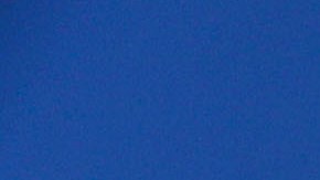Junior, an immigrant from Honduras, waves the American flag while standing with other immigrants at the U.S.-Mexico border fence on November 25, 2018 in Tijuana, Mexico. Photo by Mario Tama/Getty Images