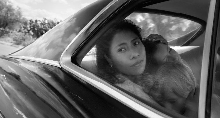 Yalitza Aparicio as Cleo, Marco Graf as Pepe, and Daniela Demesa as Sofi in 'Roma.' Image by Alfonso Cuarón.
 Courtesy of Netflix