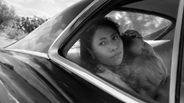 Yalitza Aparicio as Cleo, Marco Graf as Pepe, and Daniela Demesa as Sofi in 'Roma.' Image by Alfonso Cuarón.  Courtesy of Netflix