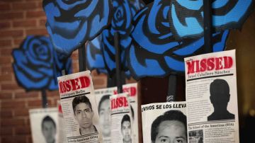 Activists hold signs during a rally to protest the Mexican governments handling of the Ayotzinapa 43 incidence outside the Inter-American Commission of Human Rights as the commission is to hear testimonies on General Human Rights Situation in the State of Guerrero, Mexico March 20, 2015 in Washington, DC.  Photo by Alex Wong/Getty Images