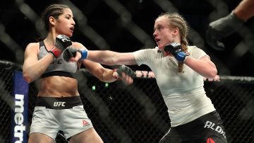 JJ Aldrich throws a punch at Polyana Viana in the second round of the women's straw weight bout during UFC 227 at Staples Center on August 4, 2018 in Los Angeles, United States. Photo by Joe Scarnici/Getty Images