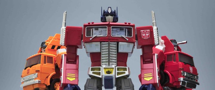 Creative Commons "Masterpiece Optimus Prime, Grapple and Inferno” by Pete Slater is licensed under CC BY 2.0