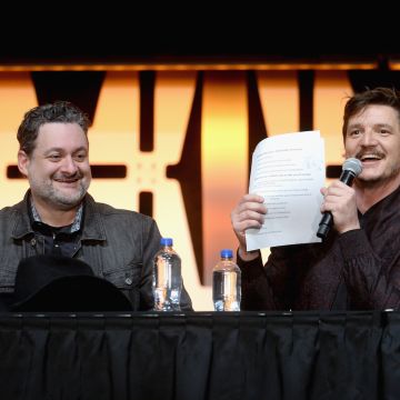 Dave Filoni and Pedro Pascal onstage during "The Mandalorian" panel at the Star Wars Celebration on April 14, 2019 in Chicago, Illinois. Photo by Daniel Boczarski/WireImage for Disney