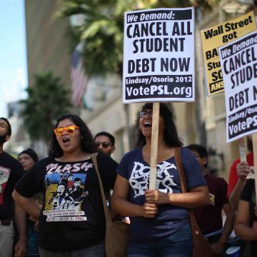 Students protest the rising costs of student loans for higher education on Hollywood Boulevard on September 22, 2012 in the Hollywood section of Los Angeles, California. Citing bank bailouts, the protesters called for student debt cancelations. Photo by David McNew/Getty Images