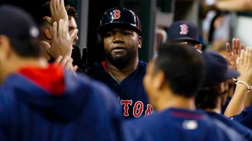 Boston Red Sox designated hitter David Ortiz (34) receives congratulations from teammates after scoring in the seventh inning against the Detroit Tigers at Comerica Park. Photo by Rick Osentoski-USA TODAY Sports  / Reuters