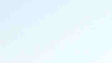 A man walks along the Mexican side of the U.S.-Mexico border barrier on April 2, 2019 in Tijuana, Mexico. Photo by Mario Tama/Getty Images