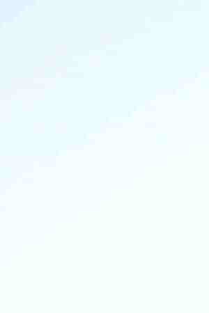 A man walks along the Mexican side of the U.S.-Mexico border barrier on April 2, 2019 in Tijuana, Mexico. Photo by Mario Tama/Getty Images