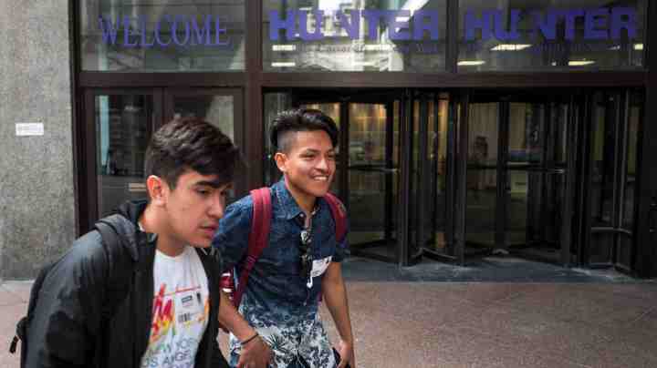 Students walk on the campus of Hunter College of The City University of New York, April 10, 2017 in New York City. Photo by Drew Angerer/Getty Images)