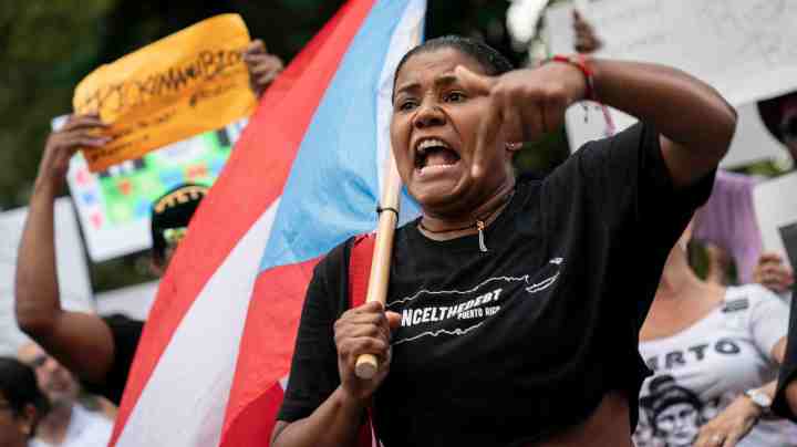 Protestors rally against Ricardo Rossello, the Governor of Puerto Rico, in Columbus Circle on July 22, 2019 in New York City. Photo by Drew Angerer/Getty Images