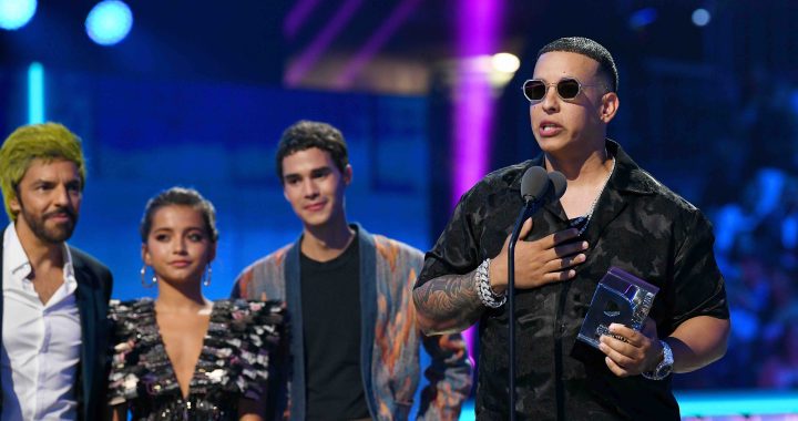 Daddy Yankee accepts an award on stage during Premios Juventud 2019 at Watsco Center on July 18, 2019 in Coral Gables, Florida. Photo by Jason Koerner/Getty Images