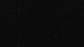 Brazilian singer and musician Joao Gilberto strums the guitar in front of a microphone during studio session. 1980s. Photo by Dario Zalis/Contexto/Getty Images