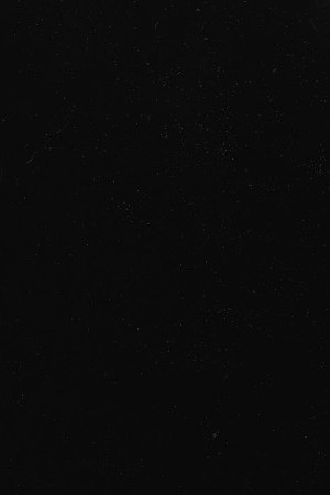 Brazilian singer and musician Joao Gilberto strums the guitar in front of a microphone during studio session. 1980s. Photo by Dario Zalis/Contexto/Getty Images