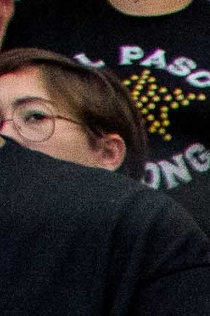 Attendees pray for the victims of the Walmart shooting at Southwest University Park, where the city of El Paso held the official vigil. Photo by Gabriela Velasquez for Remezcla