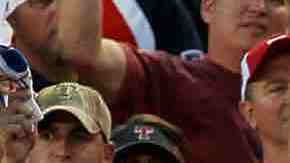 Fans cheer as Neftali Feliz #30 of the Texas Rangers pitches against the New York Yankees in Game Two of the ALCS during the 2010 MLB Playoffs at Rangers Ballpark in Arlington in 2010 in Arlington, Texas. Photo by Stephen Dunn/Getty Images