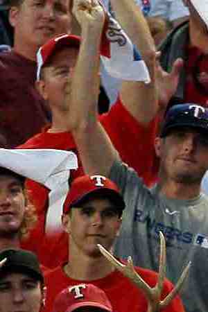 Fans cheer as Neftali Feliz #30 of the Texas Rangers pitches against the New York Yankees in Game Two of the ALCS during the 2010 MLB Playoffs at Rangers Ballpark in Arlington in 2010 in Arlington, Texas. Photo by Stephen Dunn/Getty Images