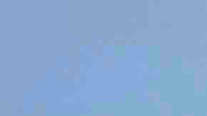 People gather at a makeshift memorial honoring victims outside Walmart, near the scene of a mass shooting which left at least 22 people dead, on August 15, 2019 in El Paso, Texas. Photo by Sandy Huffaker/Getty Images