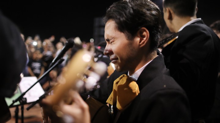Sebastian Gonzalez becomes emotional while performing with his band Mariachi Puesta del Sol at the conclusion of an interfaith vigil for victims of a mass shooting, which left at least 20 people dead, on August 4, 2019 in El Paso, Texas. Photo by Mario Tama/Getty Images
