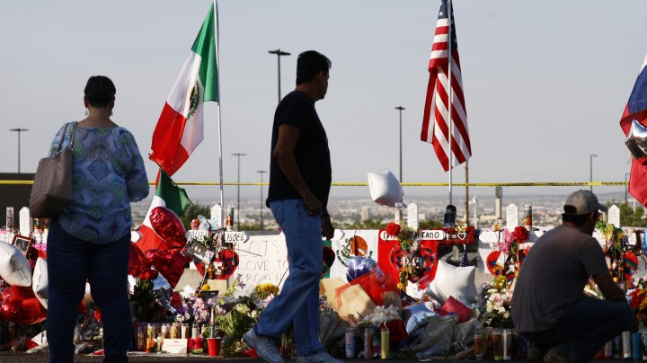 The Mexican and U.S. flags fly at a makeshift memorial honoring victims outside Walmart, near the scene of a mass shooting which left at least 22 dead. (Photo by Mario Tama/Getty Images)