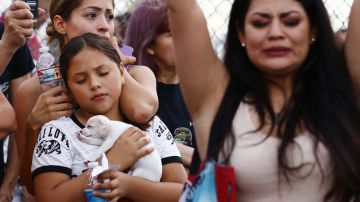 People react during an interfaith vigil for victims of a mass shooting which left at least 20 people dead, on August 4, 2019 in El Paso, Texas. Photo by Mario Tama/Getty Images