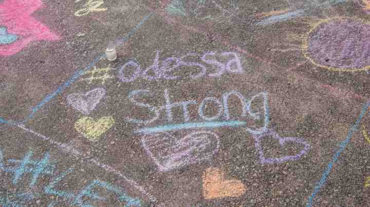 A chalk message at a memorial for victims of a mass shooting, at the University of Texas of the Permian Basin (UTPB) on September 2, 2019 in Odessa, Texas. Photo by Cengiz Yar/Getty Images