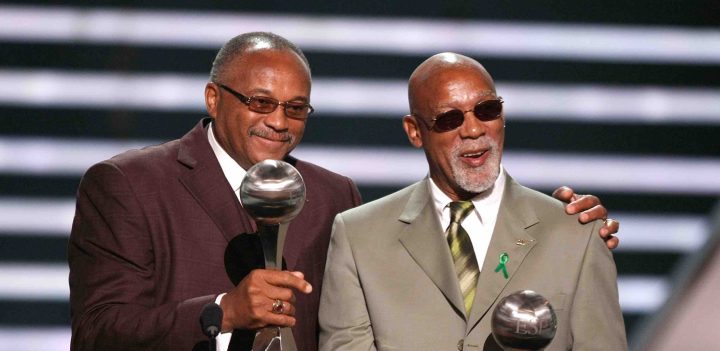 Tommie Smith and John Carlos accept the Arthur Ashe Award for Courage as they were given the award for their black-gloved fist salute at the 1968 Mexico City Olympics onstage at the 2008 ESPY Awards held at NOKIA Theatre. Photo by Kevin Winter/Getty Images