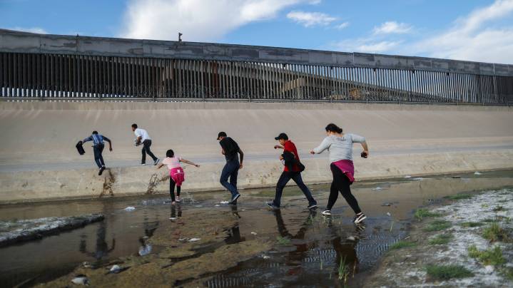 Migrants cross the border between the U.S. and Mexico at the Rio Grande river, as they enter El Paso, Texas on May 19, 2019. Photo by Mario Tama/Getty Images