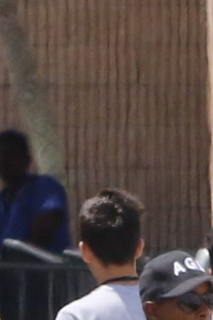 Young men walk in line under the watch of a security officer before U.S. Sen. Bill Nelson (D-FL) and U.S. Rep. Debbie Wasserman Schultz (D-FL) were denied access to the Homestead Temporary Shelter For Unaccompanied Children on June 19, 2018 in Homestead, Florida. Photo by Joe Skipper/Getty Images