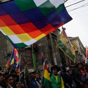 Supporters of Evo Morales wave Wiphala flags during a protest on November 14, 2019 in La Paz, Bolivia. Photo by Gaston Brito Miserocch/Getty Images