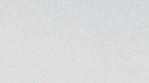 Grid fence with barbed wire against sunset. Getty Images