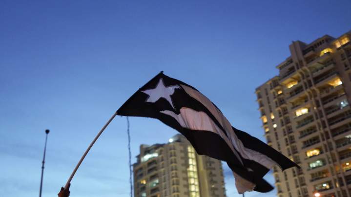 Protesters rally in front of the Department of Justice during an anti-government demonstration on July 29, 2019 in San Juan, Puerto Rico. Photo by Angel Valentin/Getty Images