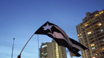 Protesters rally in front of the Department of Justice during an anti-government demonstration on July 29, 2019 in San Juan, Puerto Rico. Photo by Angel Valentin/Getty Images