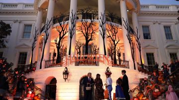 U.S. President Donald Trump and first lady Melania Trump hand out candy to trick-or-treaters during a Halloween at the White House event at the South Portico of the White House October 28, 2019 in Washington, DC. Photo by Alex Wong/Getty Images
