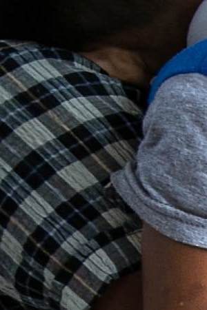 Immigrants, mostly from Central America, wait to be transported to a processing center after they were taken into custody by U.S. Border Patrol agents on July 02, 2019 in McAllen, Texas. Photo by John Moore/Getty Images