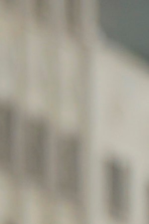 Demonstrators wave flags and hold signs in front of La Moneda presidential palace during a national strike on November 26 in Santiago, Chile. Photo by Claudio Santana/Getty Images