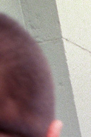 Keiko Fujimori, daughter of former President Alberto Fujimori, is escorted by body guards as she enters the congressional building January 10, 2001 in Lima, Peru. Photo by Newsmakers