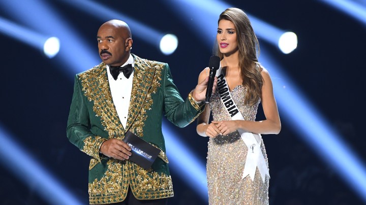 Steve Harvey interviews Miss Colombia Gabriela Tafur Náder onstage at the 2019 Miss Universe Pageant at Tyler Perry Studios on December 08, 2019 in Atlanta, Georgia. Photo by Paras Griffin/Getty Images