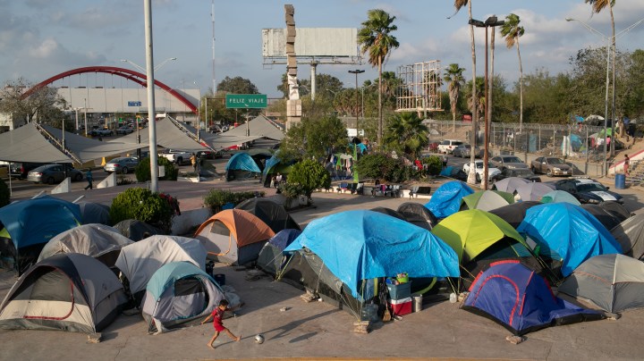 A camp for asylum seekers stands next to the international bridge to the United States on December 09, 2019 in Matamoros, Mexico. Photo by John Moore/Getty Images