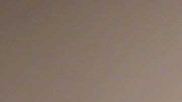 Visitors to the opening day of Art Basel look at a work  by Evan Penny titled, "female stretch variation # 2 " at the Miami Convention Center on December 5, 2013 in Miami Beach, Florida. Photo by Joe Raedle/Getty Images