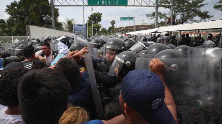 Members of the migrant caravan clash with Mexican riot police at the border between Mexico and Guatemala on October 19, 2018 in Ciudad Tecun Uman, Guatemala. Photo by John Moore/Getty Images