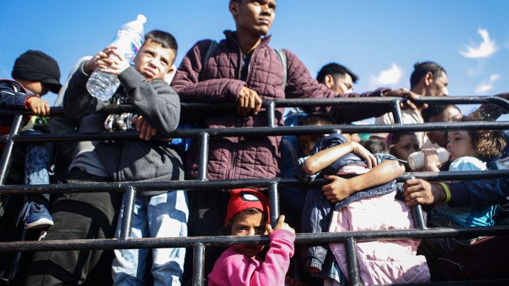 People from a caravan of Central American immigrants wait to ride on a truck, whose driver offered a ride, on their way toward the United States, on January 22, 2019 in Santo Domingo Zanatepec, Mexico. Photo by Mario Tama/Getty Images