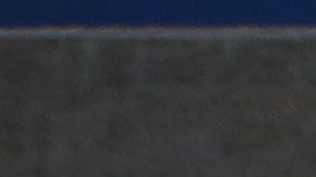 A woman stands at the El Chapparal port of entry, with a sign pointing toward the U.S., on January 25, 2019 in Tijuana, Mexico. Photo by Mario Tama/Getty Images