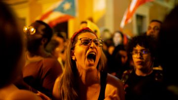 Protestors demand the resignation of Governor Wanda Vázquez Garced during new protests in front of the Governor’s mansion. Photo by Jose Jimenez/Getty Images