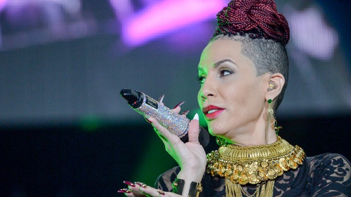 Ivy Queen on stage at Grand Slam Party Latino at Marlins Park. Photo by Rodrigo Varela/Getty Images