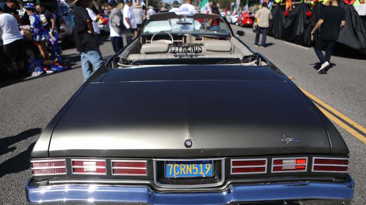 A 'lowrider' car is parked before the 72nd annual East LA Mexican Independence Day Parade on September 16, 2018 in Los Angeles, California. Photo by Mario Tama/Getty Images