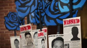 Activists hold signs during a rally to protest the Mexican government's handling of the missing Ayotzinapa 43 outside the Inter-American Commission of Human Rights as the commission is to hear testimonies on General Human Rights Situation in the State of Guerrero, Mexico March 20, 2015 in Washington, DC. Photo by Alex Wong/Getty Images